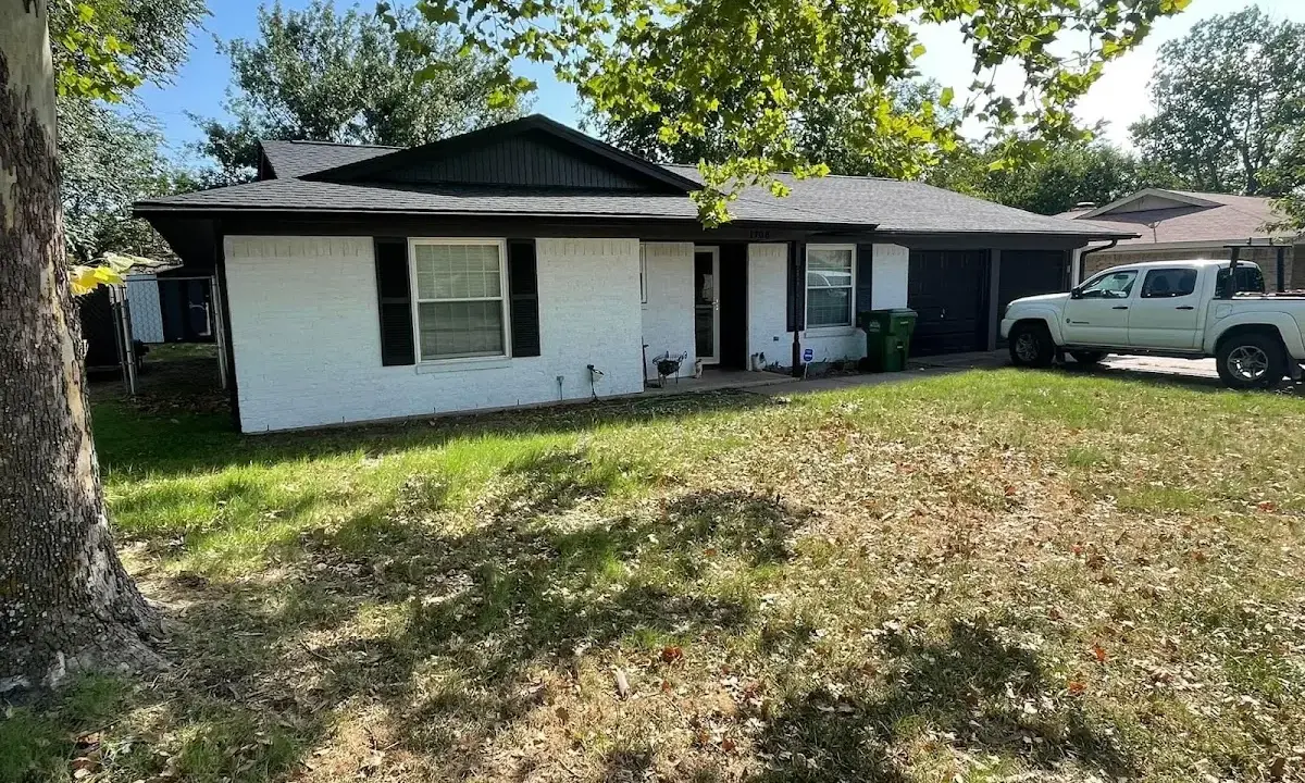Professional roofing crew working on a residential roof in Thief River Falls